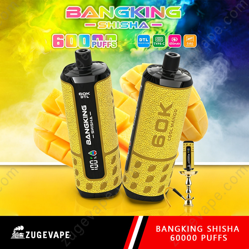 Bang King Shisha 60000 Puffs – Dtl Shisha 60K Vape 7 Two Yellow And Black Bangking Shisha 6000 Puffs Vape Devices With Dotted Pattern, Displayed Upright With Mango Slices In The Background And A Small Accessory On The Right.
