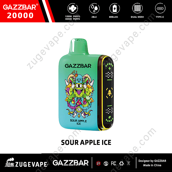 Uno svapo monouso Gazzbar al gusto di ghiaccio alla mela acida, caratterizzato da un design vivace con una combinazione di colori verde e blu, un'illustrazione di un mostro ed etichettato con 20.000 tiri, capacità di 28 ml, batteria da 800 mAh, doppie bobine a rete e ricarica di tipo C.
