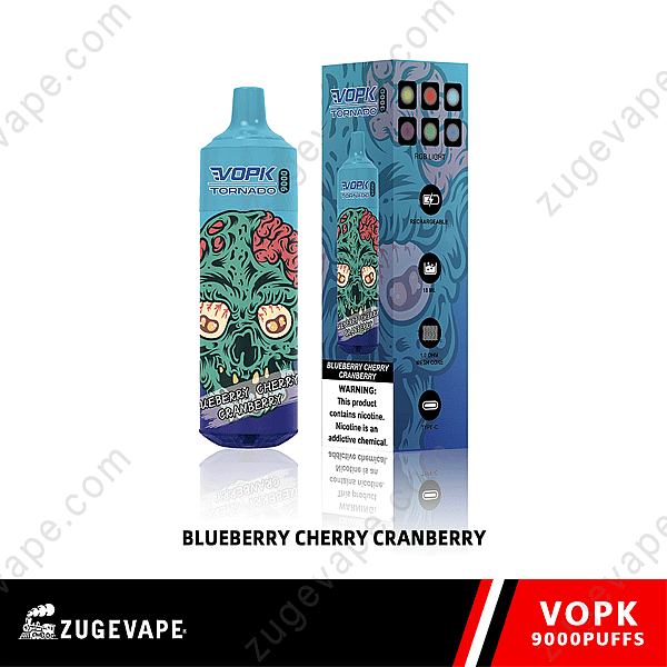 Blue Vape Device And Packaging With A Colorful Design Featuring A Zombie Face, Labeled &Quot;Vopk Tornado&Quot; And &Quot;Blueberry Cherry Cranberry,&Quot; Warning That It Contains Nicotine.