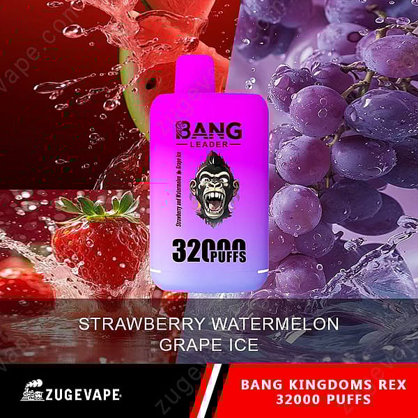 Un empaque de dispositivo de vapeo que presenta un diseño morado y blanco con un logotipo de gorila, etiquetado como &quot;Bang Leader&quot; y &quot;Strawberry Watermelon Grape Ice&quot; junto con &quot;32000 Puffs&quot;. El fondo incluye salpicaduras de sandía roja, fresas y uvas.