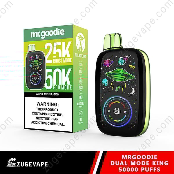 A Mr. Goodie Branded Vaping Device And Its Packaging Showcasing Its Design With Ufo-Themed Graphics And Text Indicating Dual Modes With 25K Boost Mode And 50K Eco Mode In Apple Cinnamon Flavor.