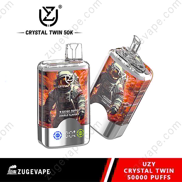 Two Branded Vape Devices Labeled 'Uzy Crystal Twin 50K,' Featuring Colorful Designs With An Astronaut Set Against A Fiery Orange Background, Advertising 50,000 Puffs And Double Flavor Options Like Blueberry And Cherry Ice.